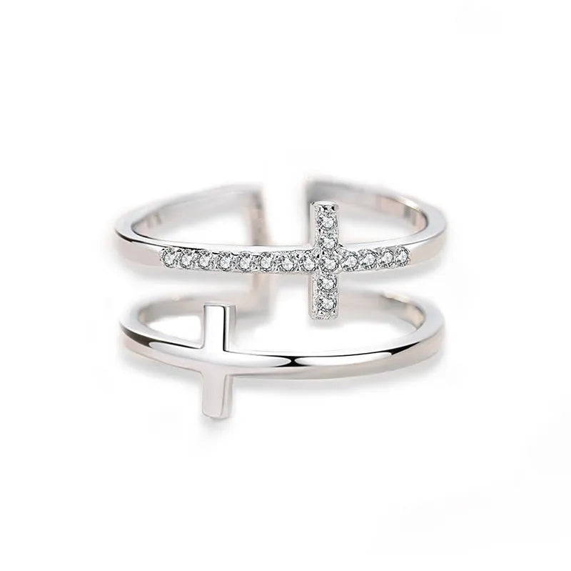 Geometric adjustable copper ring with a white gold finish and a central zircon stone in a sterling silver setting.