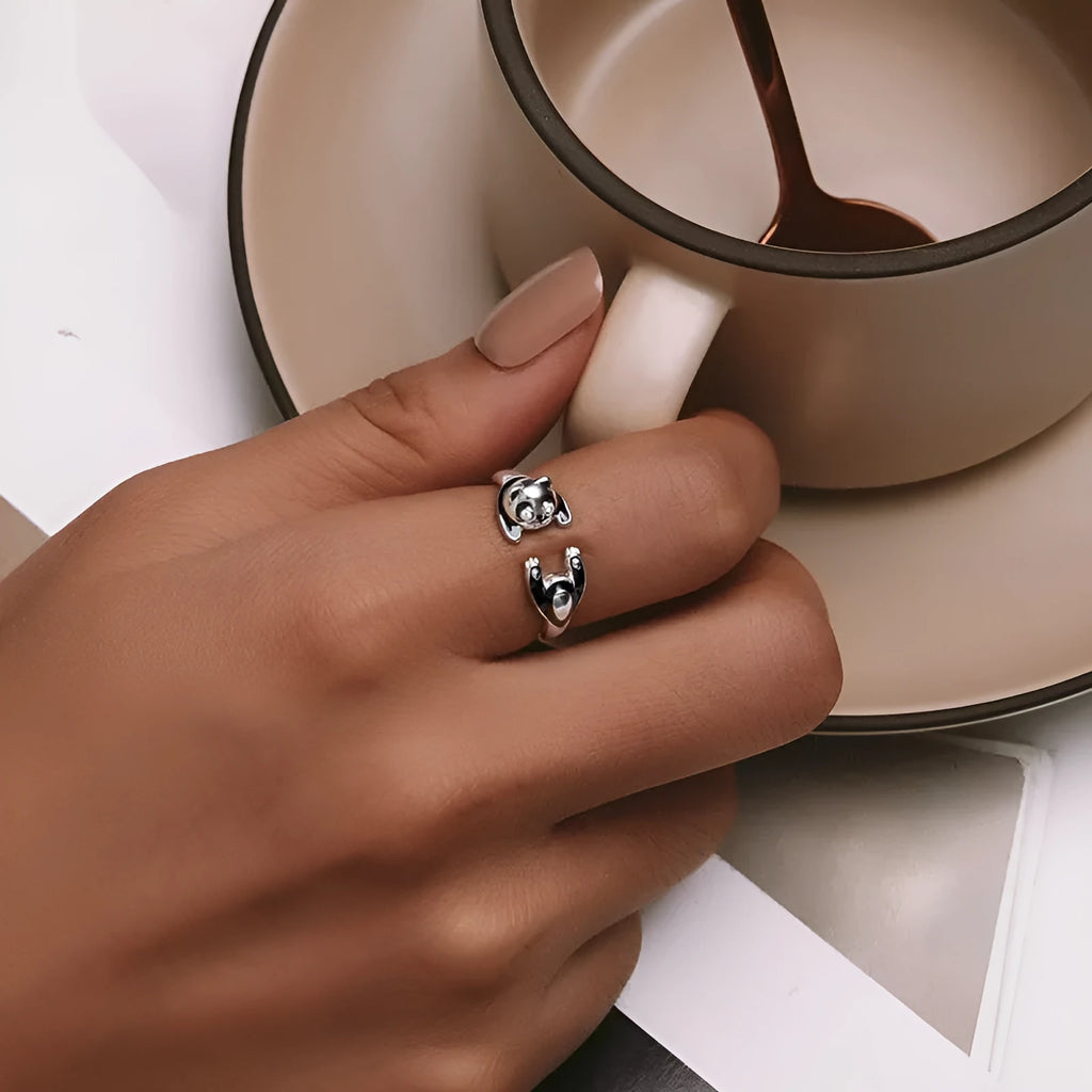 Adjustable sterling silver panda open ring bracelet with white gold plating on model finger
