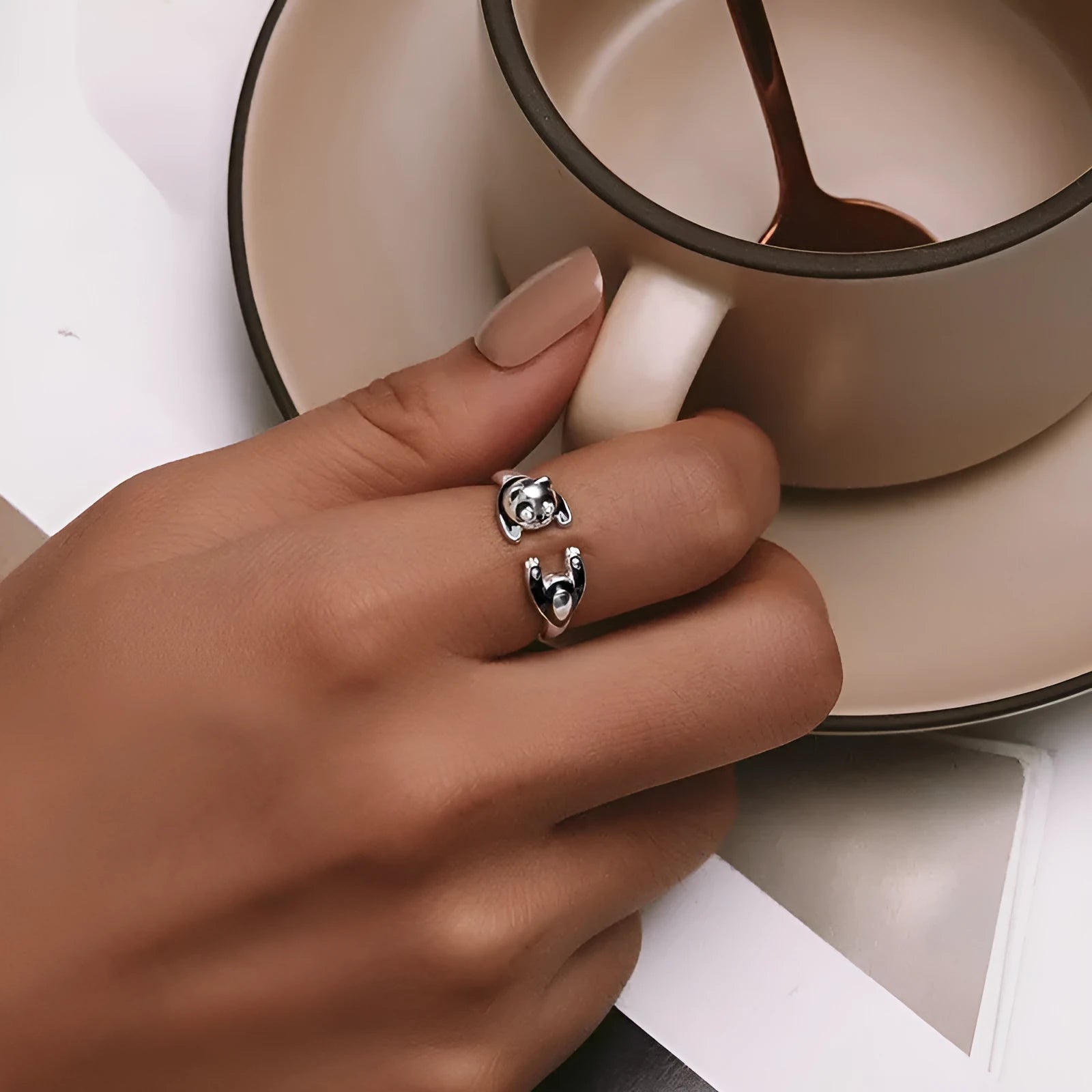 Adjustable sterling silver panda open ring bracelet with white gold plating on model finger