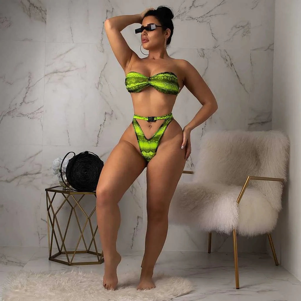 Women's purple snakeskin floral print bikini set with long sleeves and shorts.