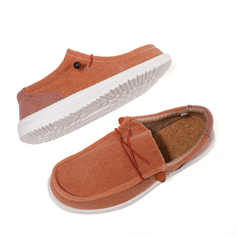 Men's casual canvas shoe in green with mosaic detail and rubber sole, shown from the side.