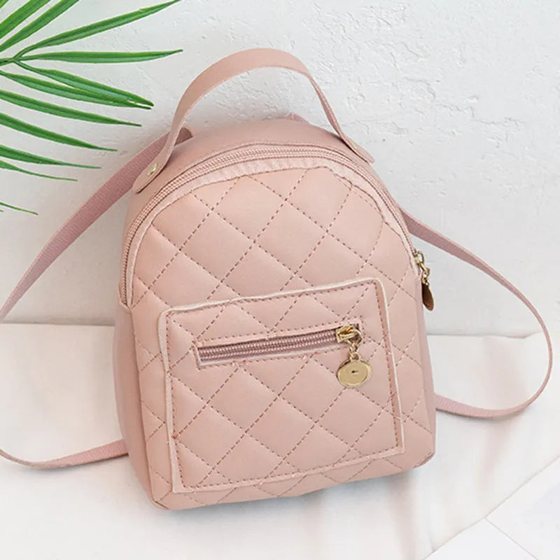 Hard square vertical girls' backpack in PU with embroidery, showing front sandwich pocket and soft carry handle.