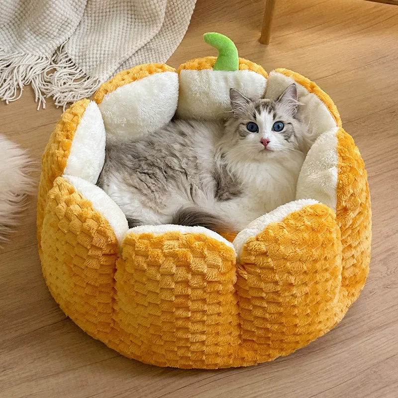 Orange pumpkin-shaped enclosed pet bed for cats or small dogs with cotton filling.