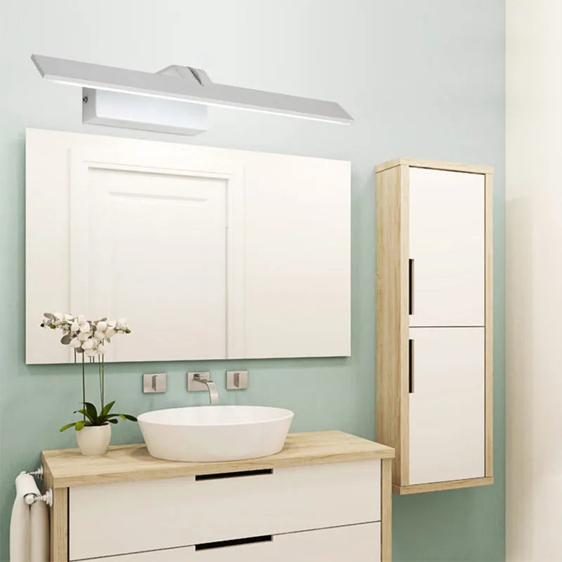 White LED strip light mounted above a bathroom mirror, showing slim profile and even illumination.