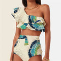 White women's one-shoulder swimsuit with lotus leaf trim and high-leg split.