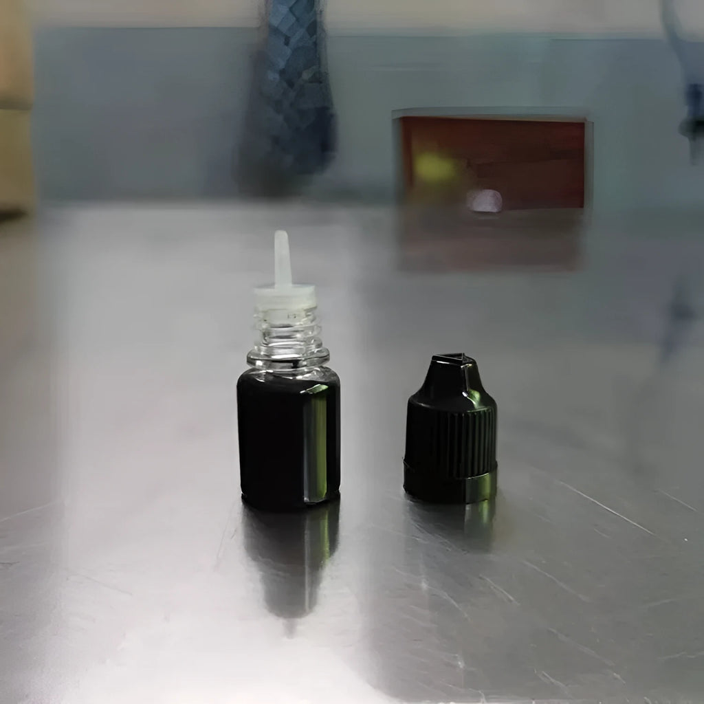 A 5ml bottle of black quick-dry confidentiality seal ink for security stamping.