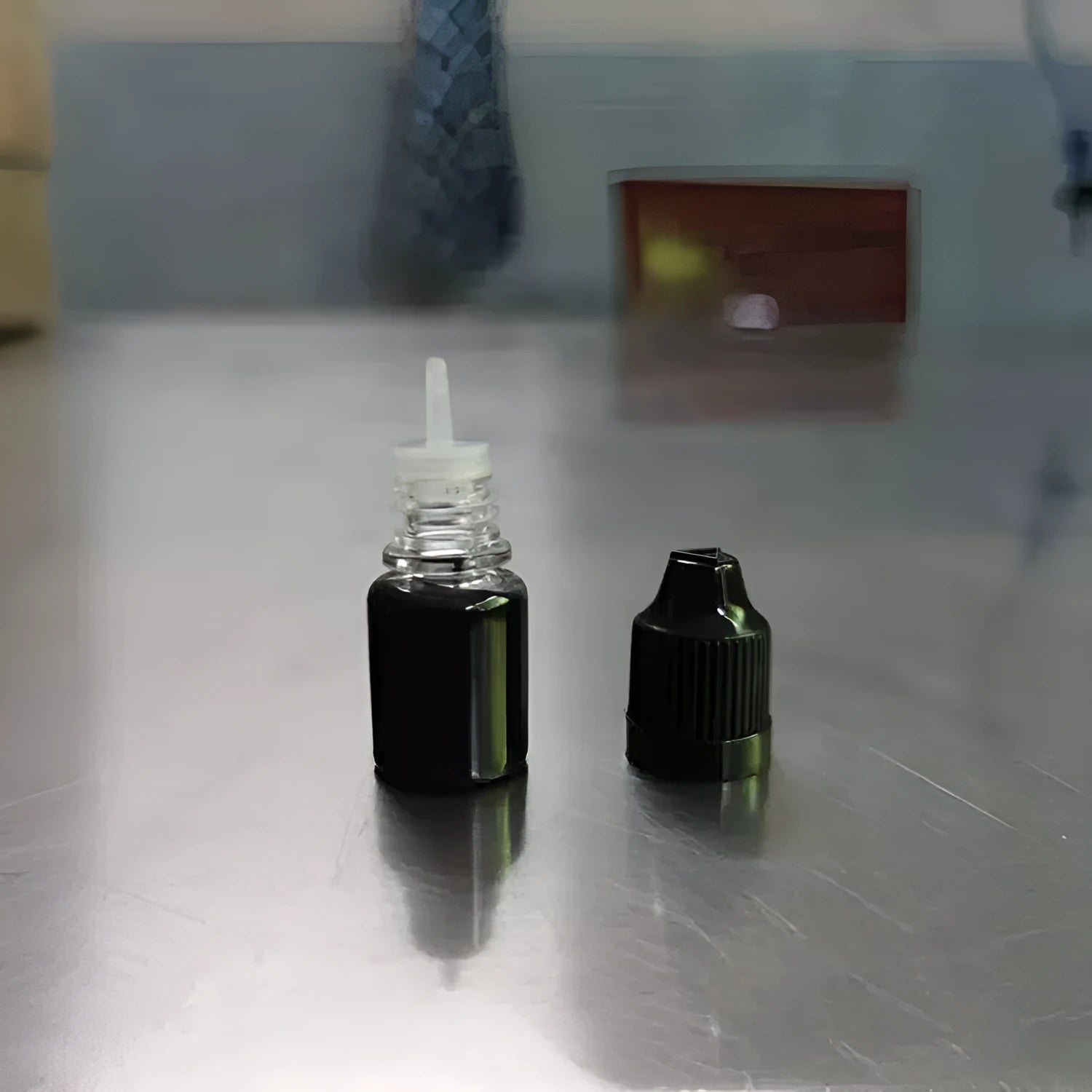 A 5ml bottle of black quick-dry confidentiality seal ink for security stamping.