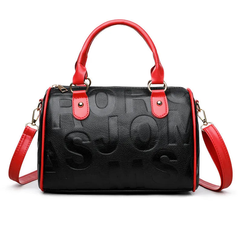 Red cylindrical crossbody bag with three straps and authentic leather tactile feel