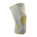 Cotton mountaineering knee pads in blue, green and yellow colours showing elastic sports knee protection