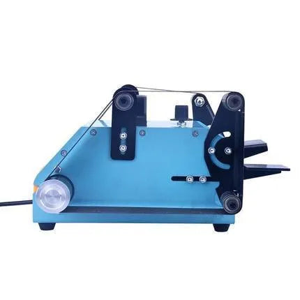 Blue desktop belt sander with variable speed control for sharpening knives and tools on a workbench.