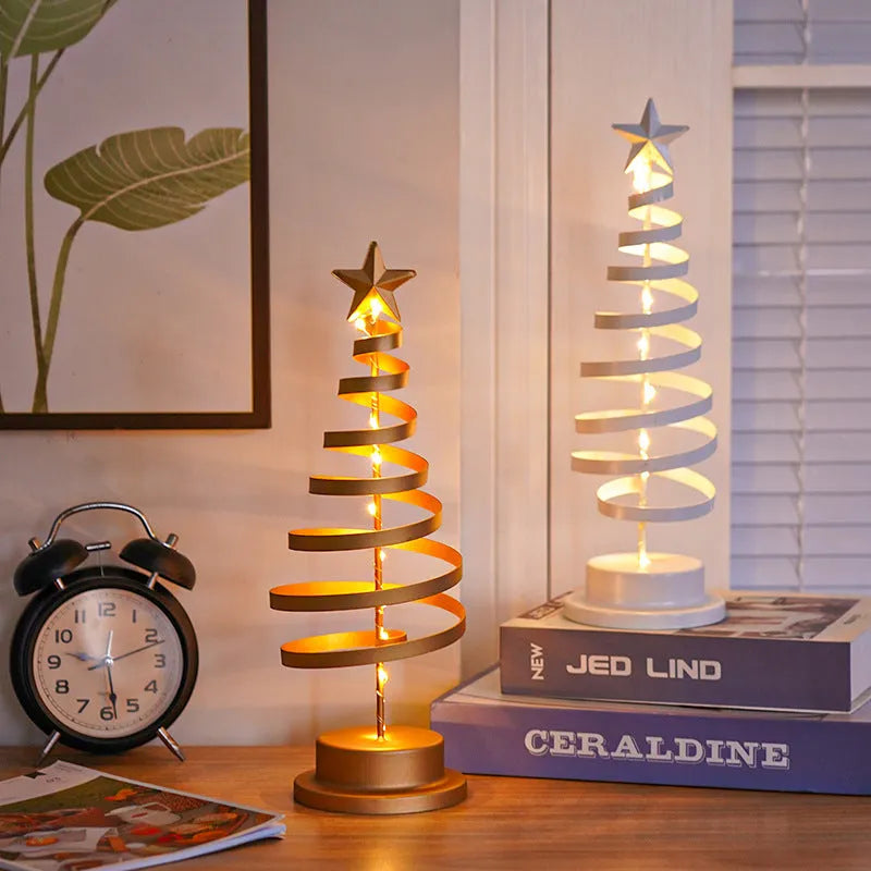 Wrought iron metal LED Christmas tree spiral light with warm white illumination on tabletop