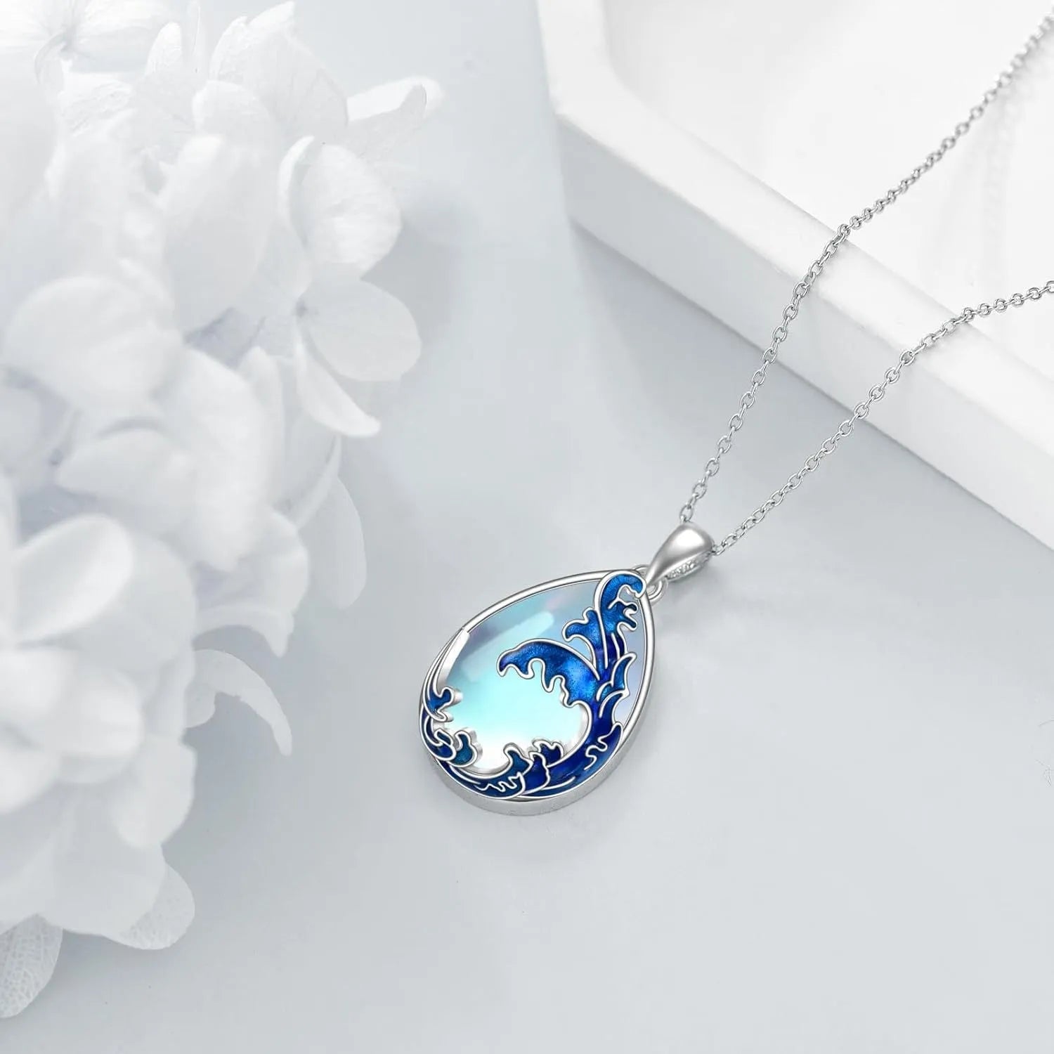 Blue heart-shaped alloy pendant necklace for women showing moonstone colour finish.