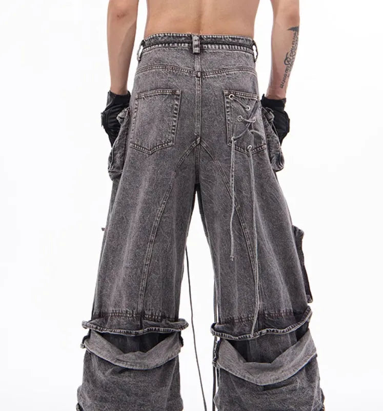 Grey distressed denim mop pants overalls with rope stitching detail on a hanger