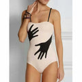 Women's one-piece bikini swimsuit with a gauze skirt, made from polyester fibre.