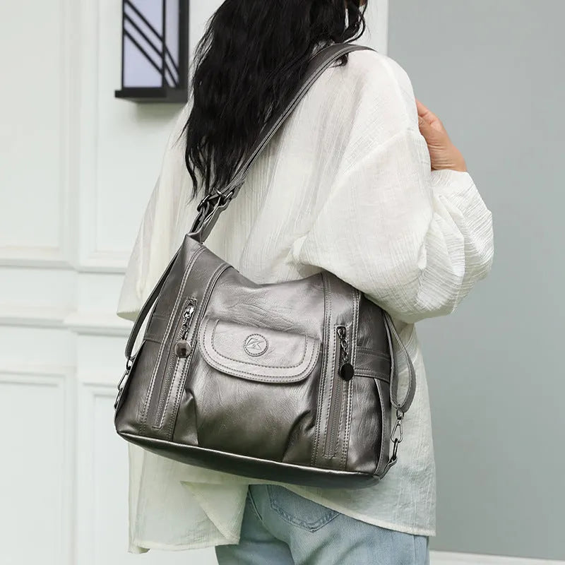 Women's multi-functional shoulder messenger bag in black PU leather with horizontal square shape and sewing line detailing