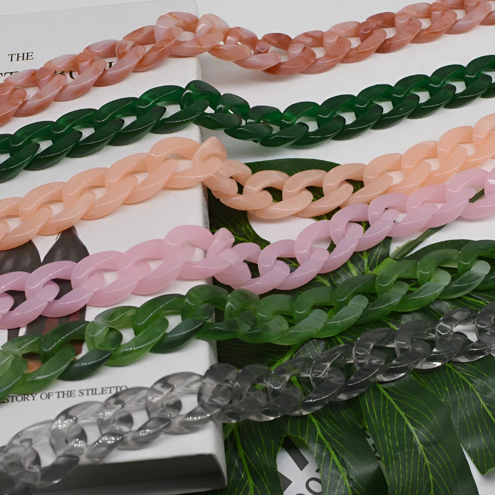 Acrylic bag chain shoulder strap in black, broken ring measuring 20cm x 30cm, plastic material