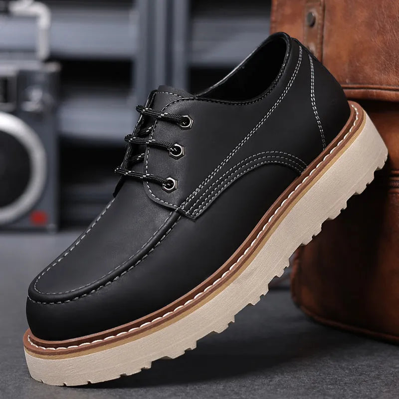Men's black low-top retro Martin boots with a round toe and non-slip rubber sole.