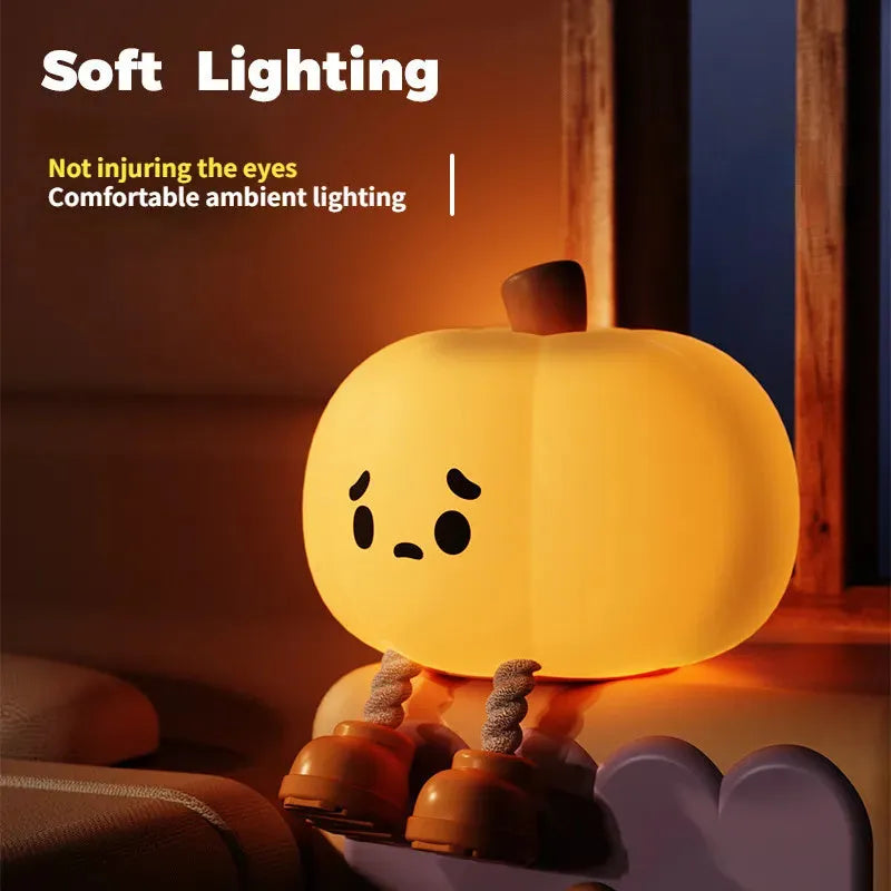 Soft silicone pumpkin night light with touch dimming controls and USB charging port