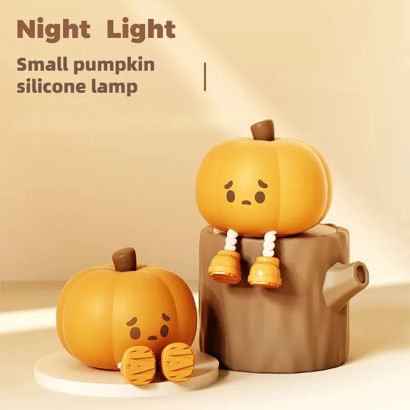 Soft silicone pumpkin night light with touch dimming controls and USB charging port