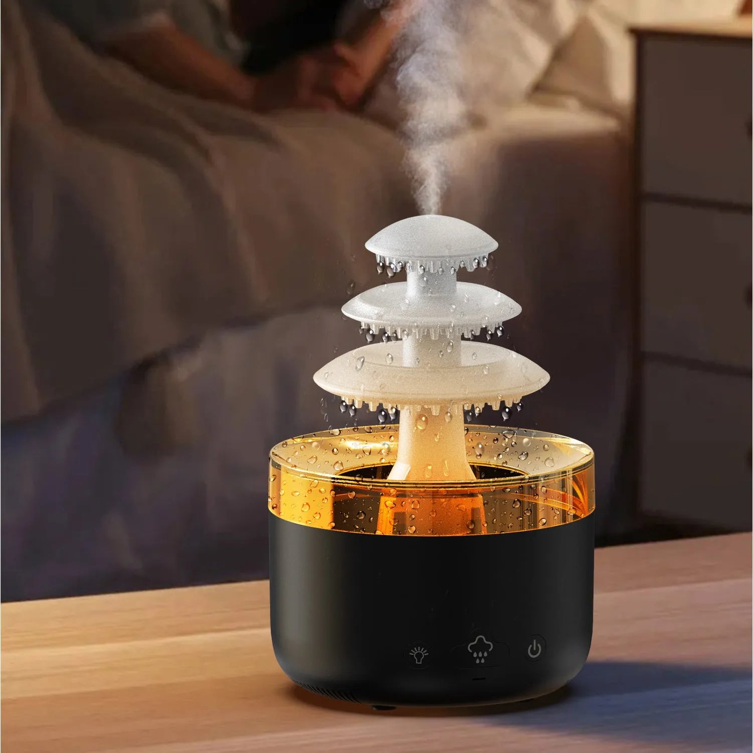 White cloud rain design ultrasonic air humidifier and essential oil diffuser with colourful LED lights on a table.
