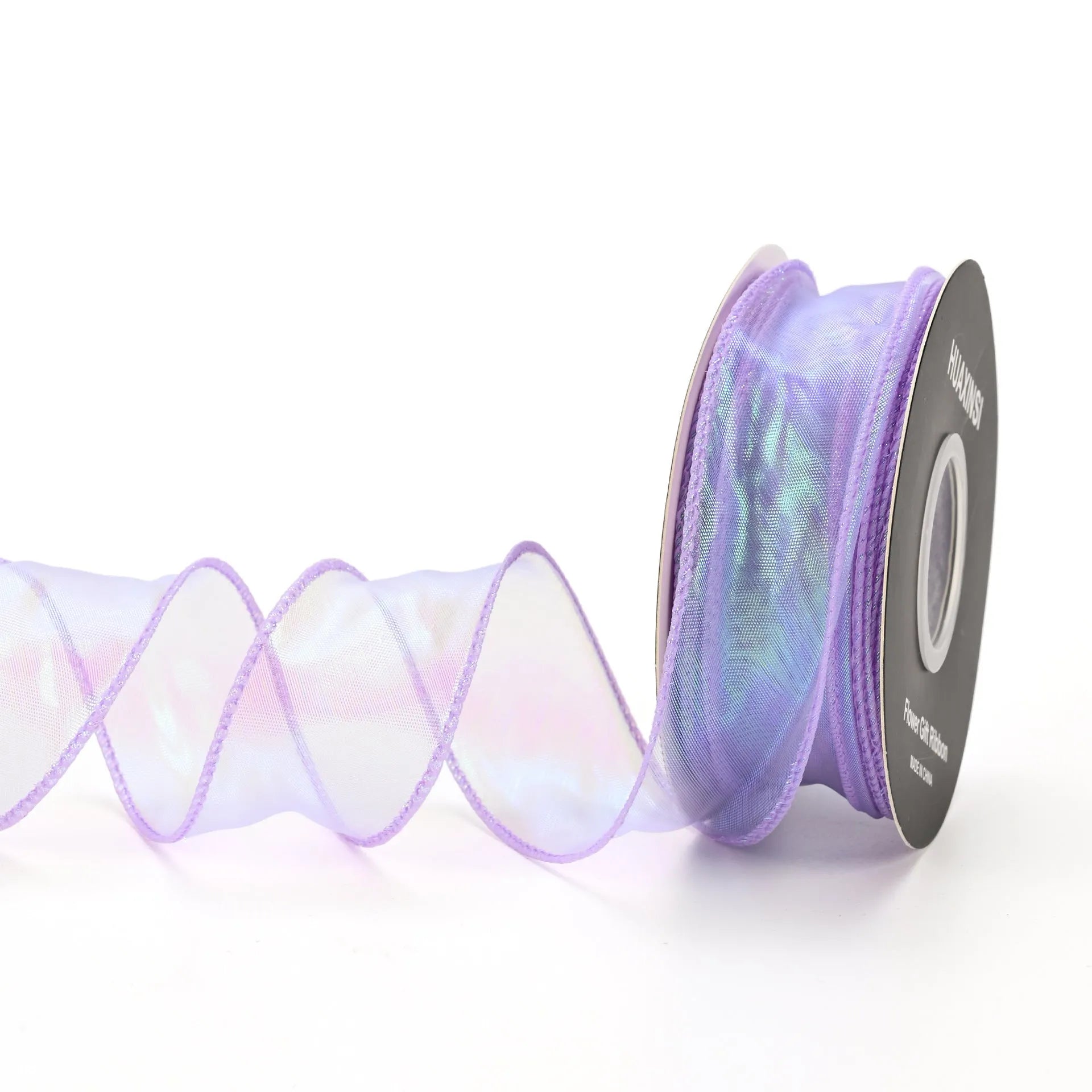 Roll of colourful fishtail yarn wave ribbon in mesh material, showing its textured, wave-like design.