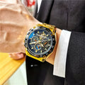 Men's automatic mechanical watch with a 12mm case in silver, black, and gold colour options on a wrist.