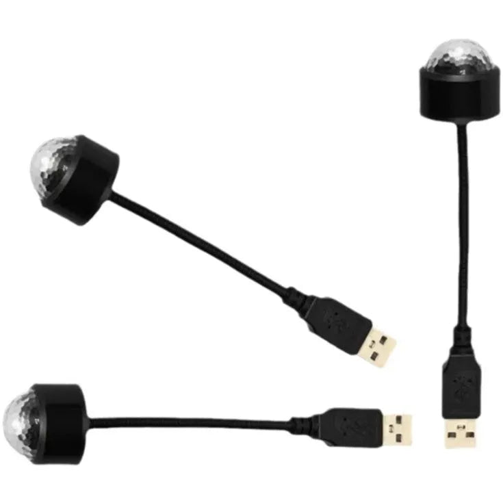 USB car atmosphere projection star light in black ABS plastic plugged into a vehicle interior