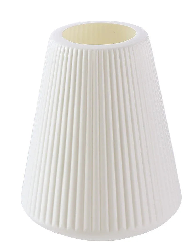 Colourful melamine plastic decorative flower vase, 16 cm by 20 cm, on a desktop.