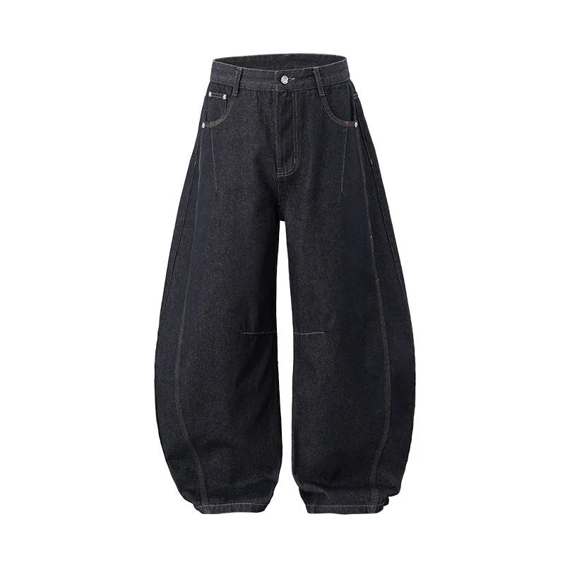 Men's wide leg denim trousers in original cow colour, laid flat to show mid-waist and relaxed fit.