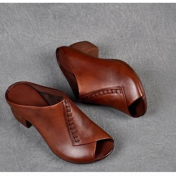 Women's black square heel peep-toe slippers with a fish mouth scaffold design on a rubber sole.