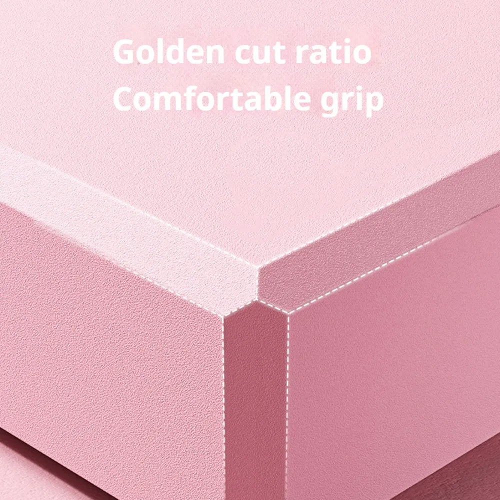 Solid colour high-density EVA yoga brick with hexagonal ridges on a gym floor.