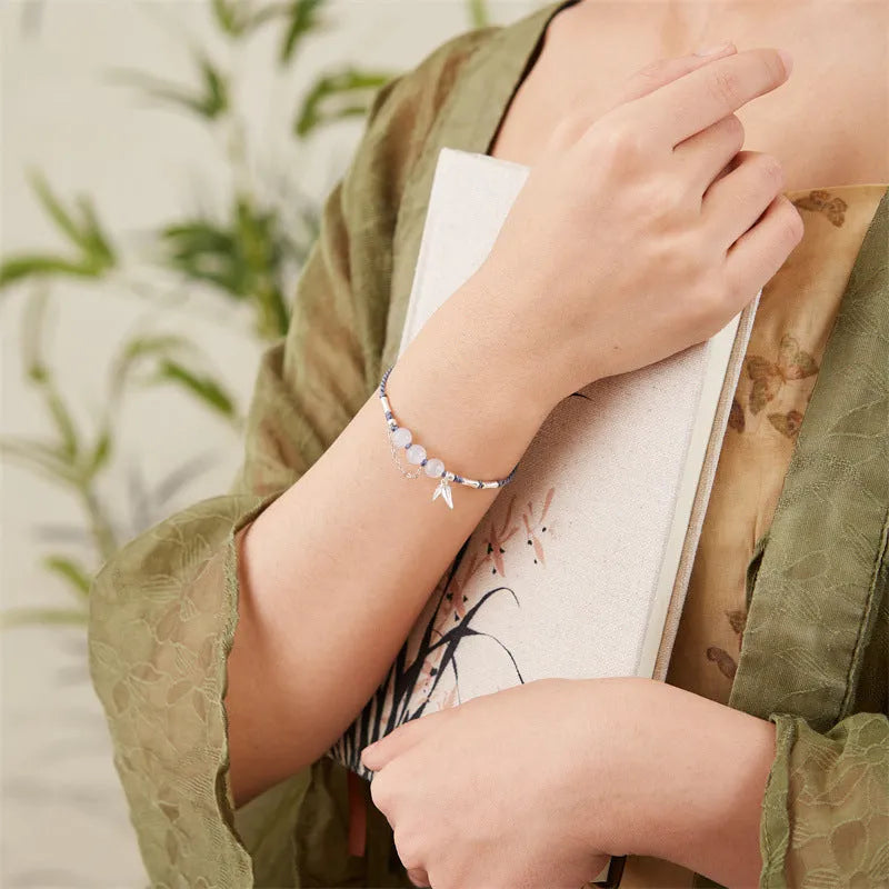 Hetian jade diamond-shaped bracelet with woven carrying strap and lotus seedpod detail