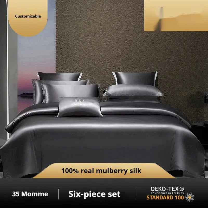 Household Fashion solid colour silk quilt cover set with two pillowcases on a bed