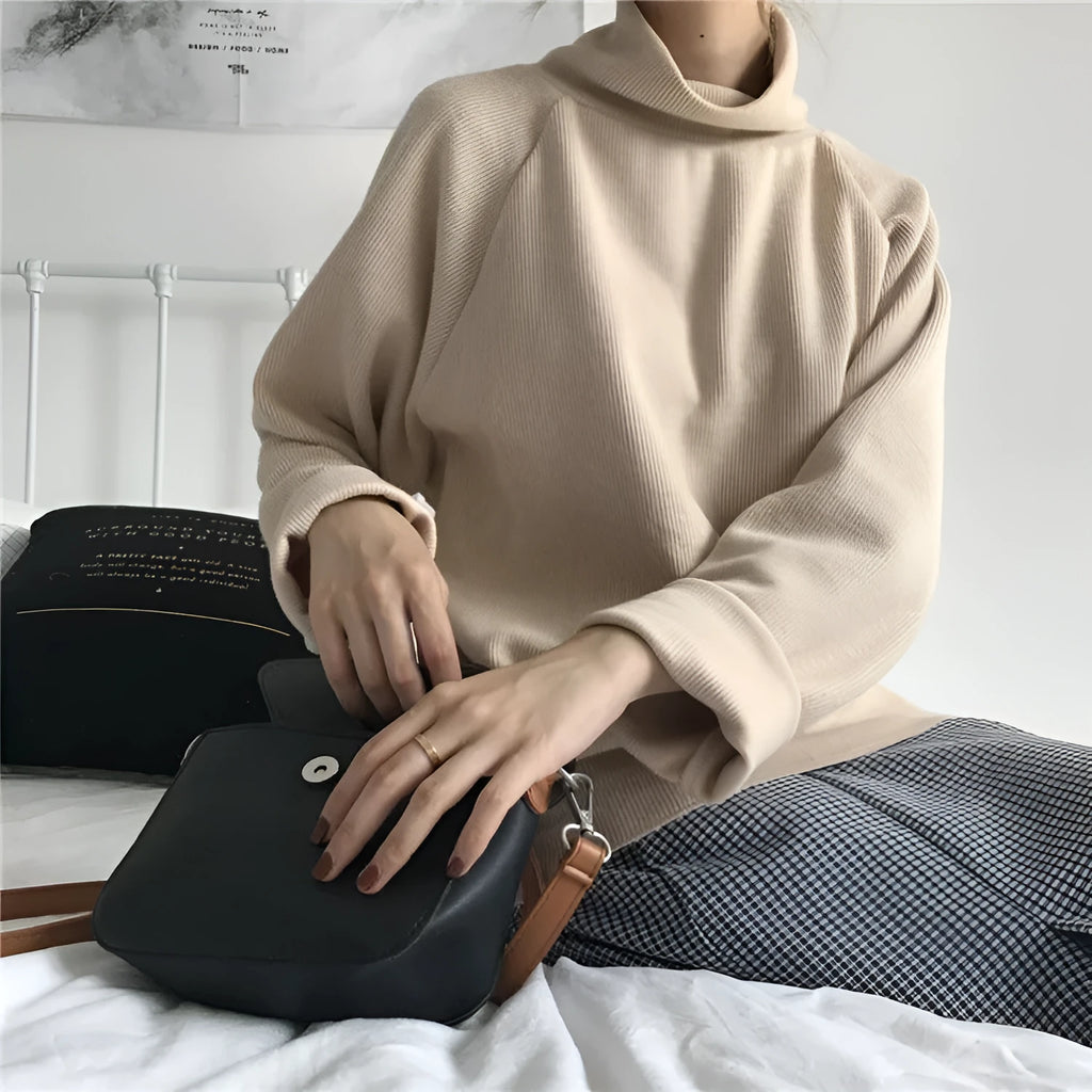 Women's solid colour loose-fit top with a half-high collar and long sleeves in apricot.