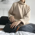 Women's solid colour loose-fit top with a half-high collar and long sleeves in apricot.