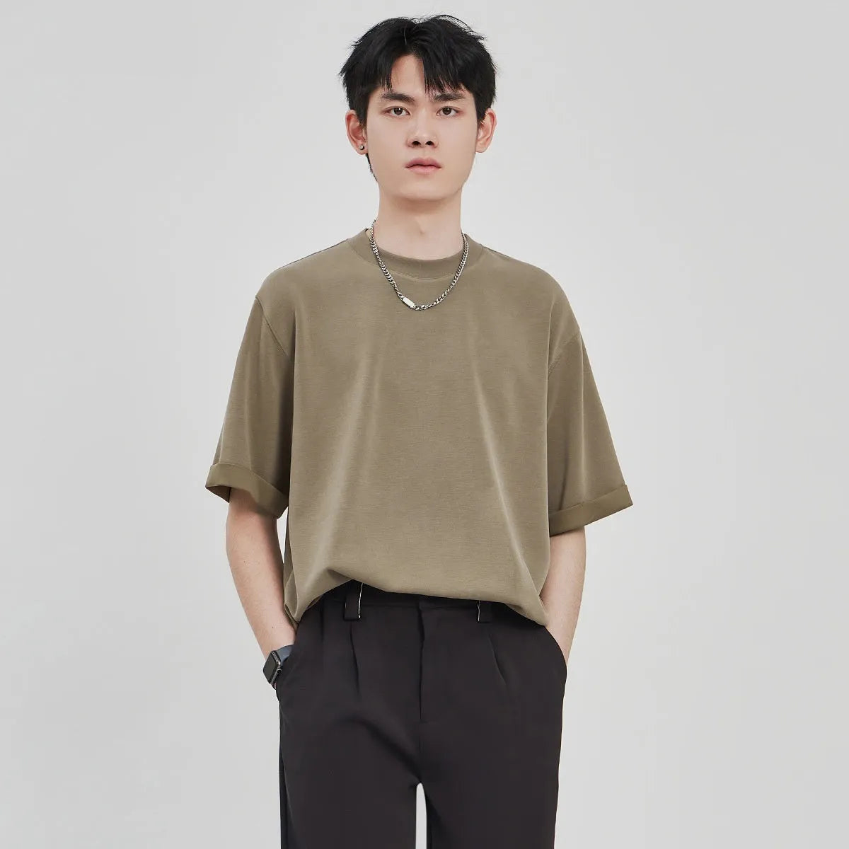 Men's loose fit drape knit T-shirt in polyester blend fabric available in black, brown, and white colours