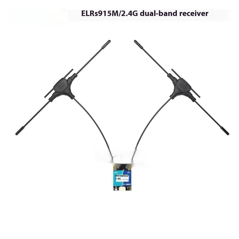 ELRS dual-band 915MHz 2.4GHz FPV receiver with two T-shaped antennas and connecting cables on a table.