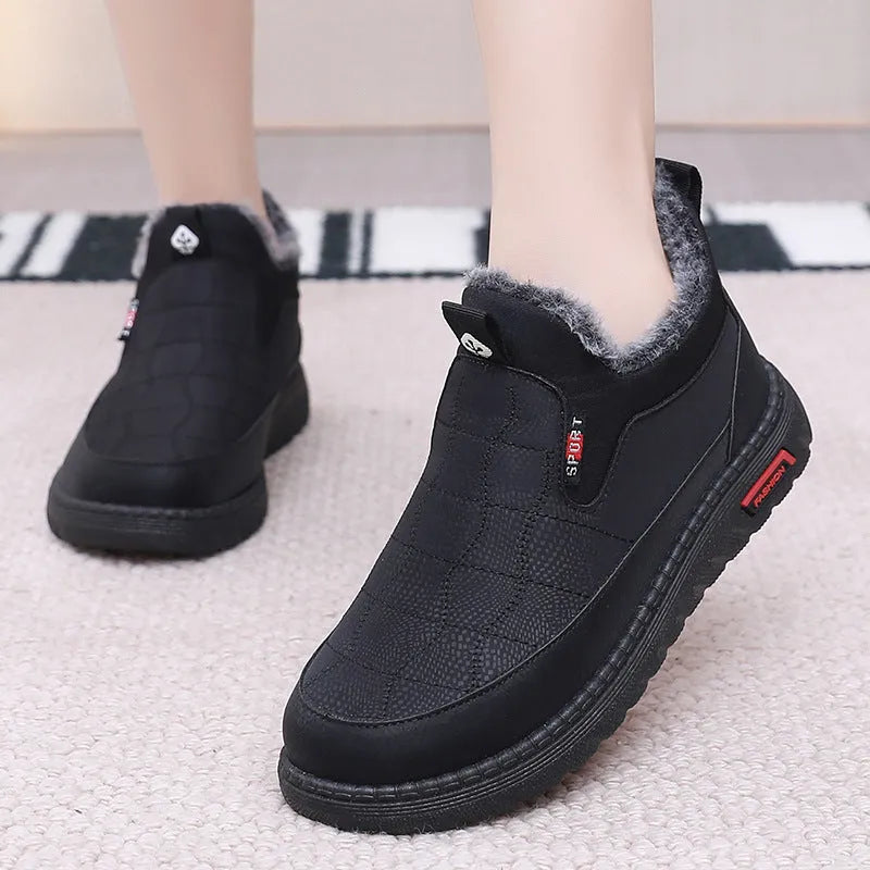 Women's black casual flat ankle boots with a synthetic leather upper and rubber sole.