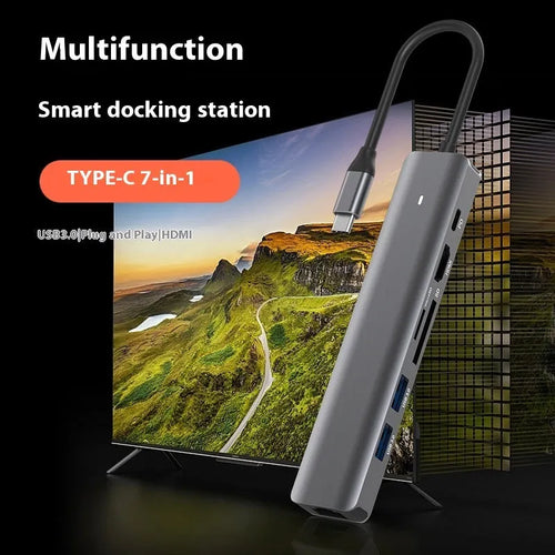 7-in-1 USB-C multi-port hub with SD card slot, microSD slot, three USB ports, and PD charging port.