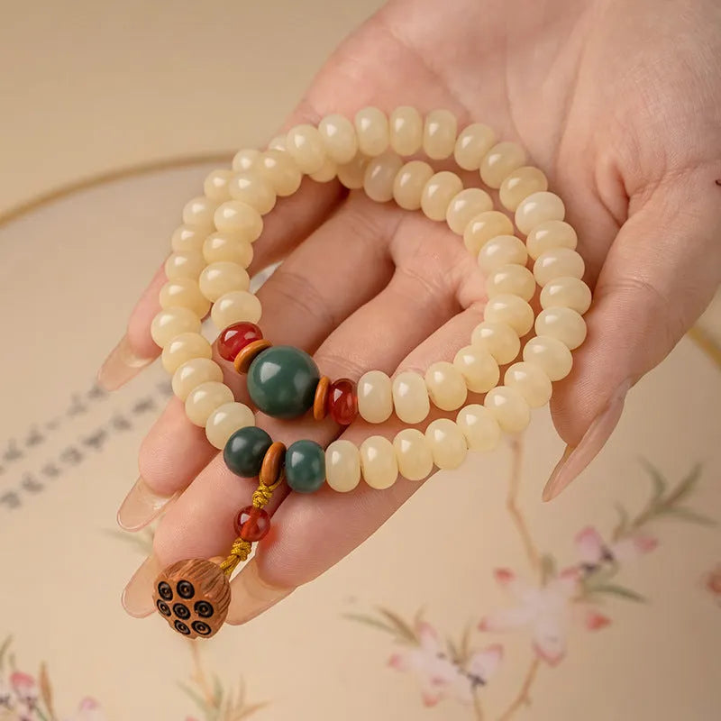 Women's wooden Bodhi root bracelet with 6x9mm flat round beads in cream colour