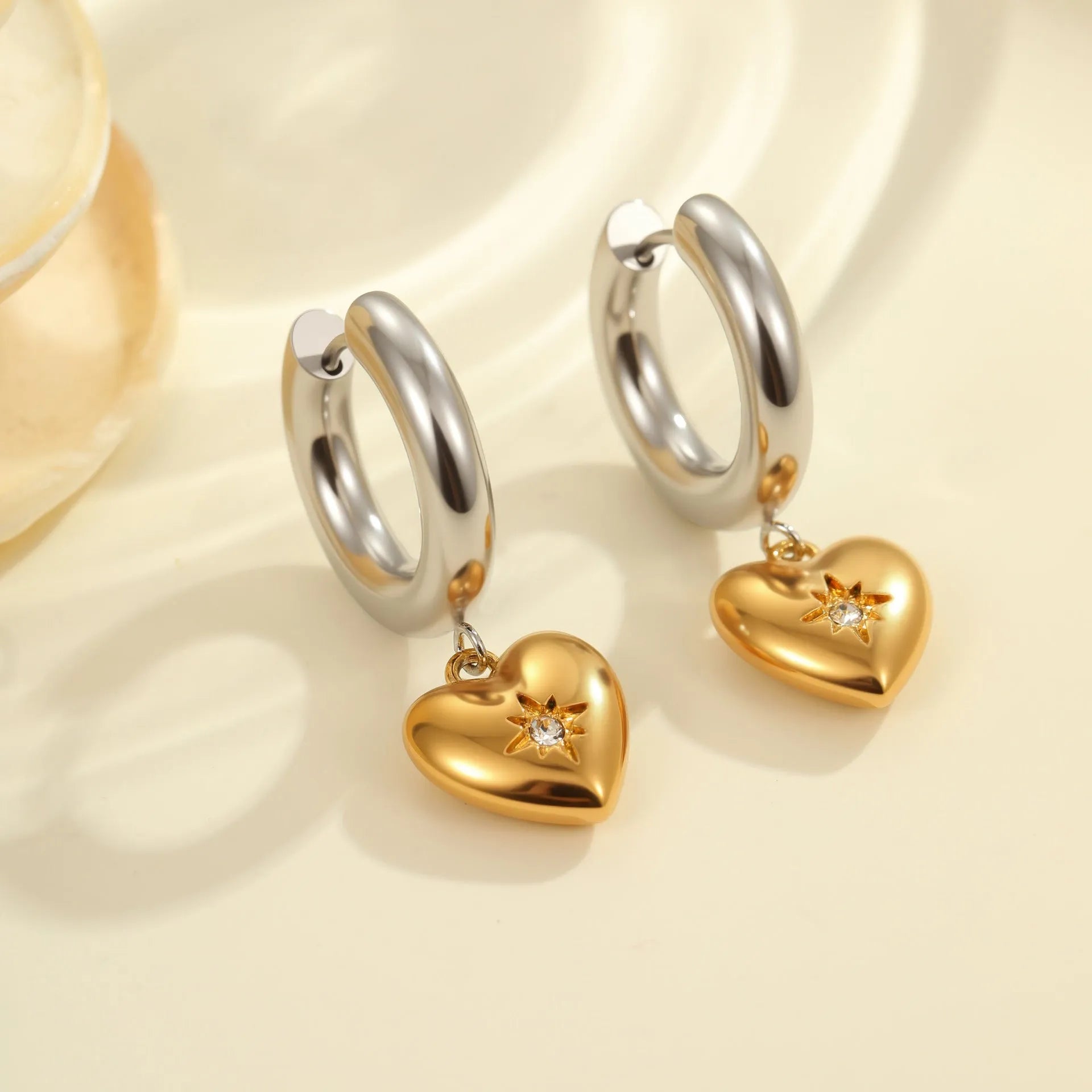 Stainless steel Christmas tree heart earrings with electroplated 18K gold finish showing heart and star shapes
