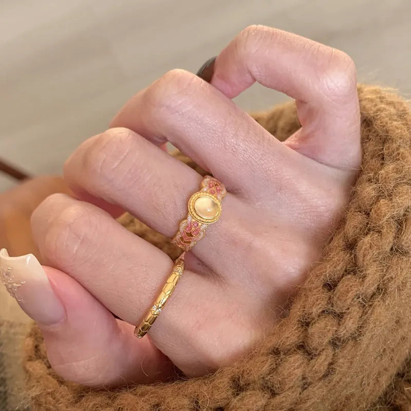 Geometric open mouth ring with pink crystal enamel detailing on copper gold plated band