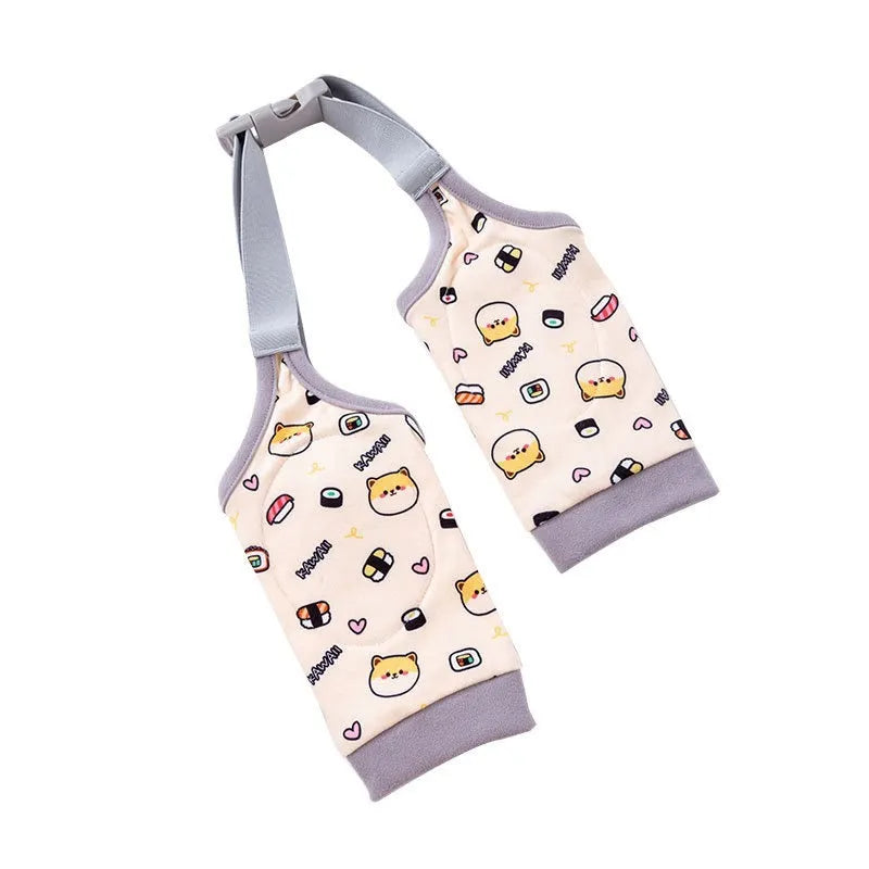 Dog wearing blue knee protector pad with elbow padding and matching scarf with doggie print pattern