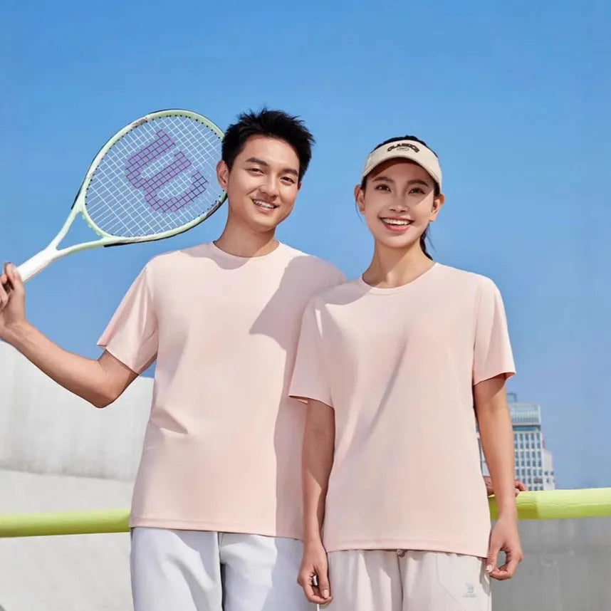 Men's loose fit solid colour polyester sports t-shirt on a hanger, showing short sleeves and casual cut.