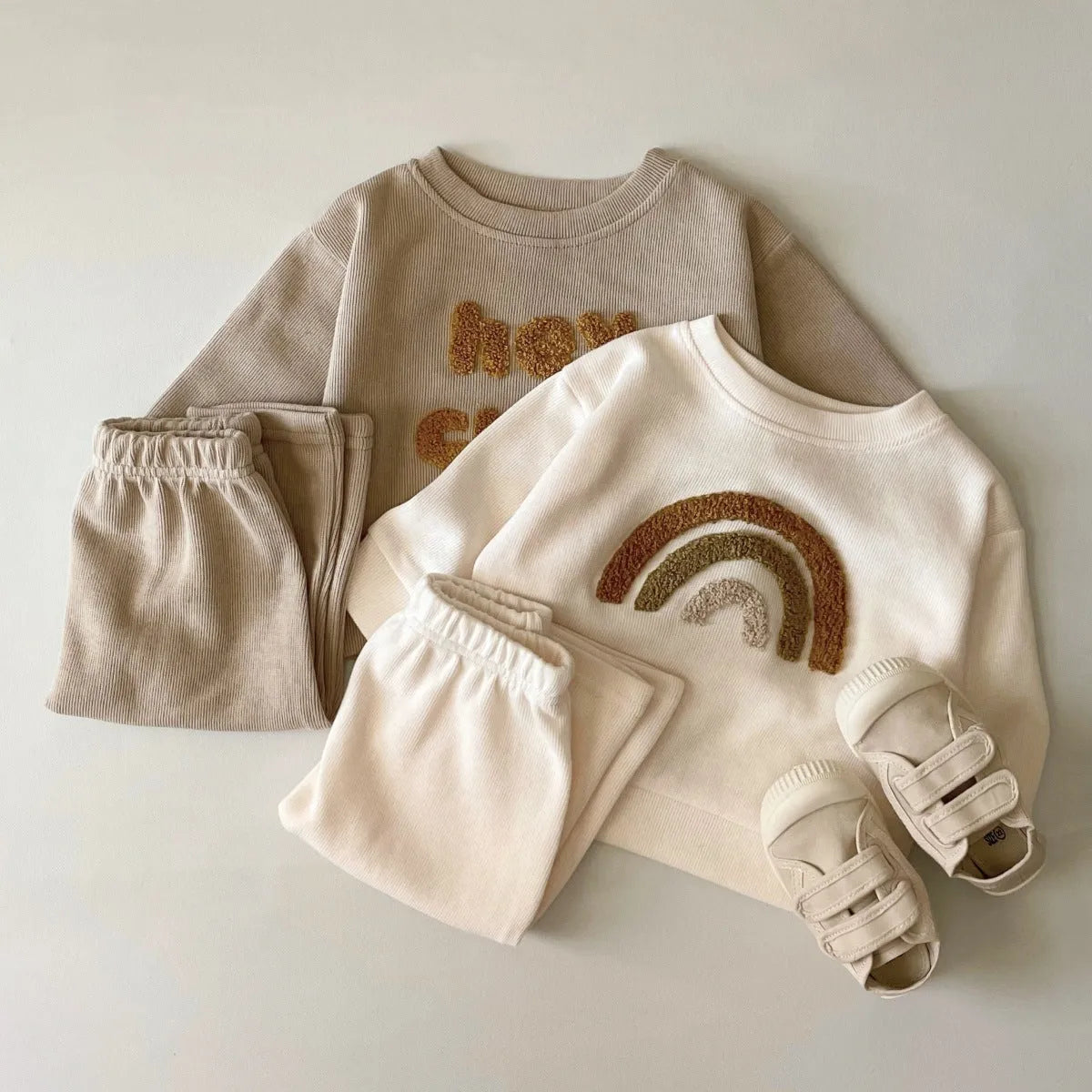 Creamy-white baby cotton two-piece suit with alphabet embroidery on long sleeve blouse and matching trousers