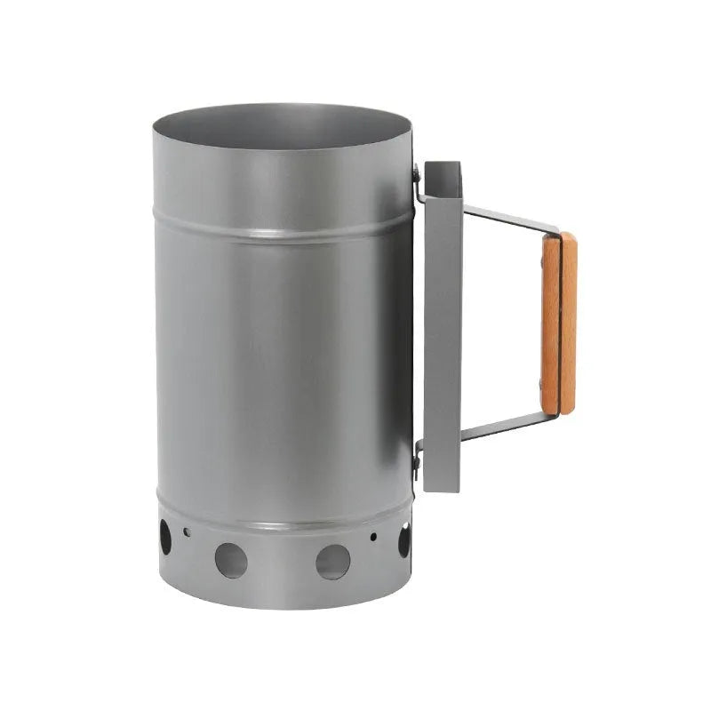 Zinc-iron alloy charcoal barbecue oven igniter with pointed carbon barrel design on a garden table.