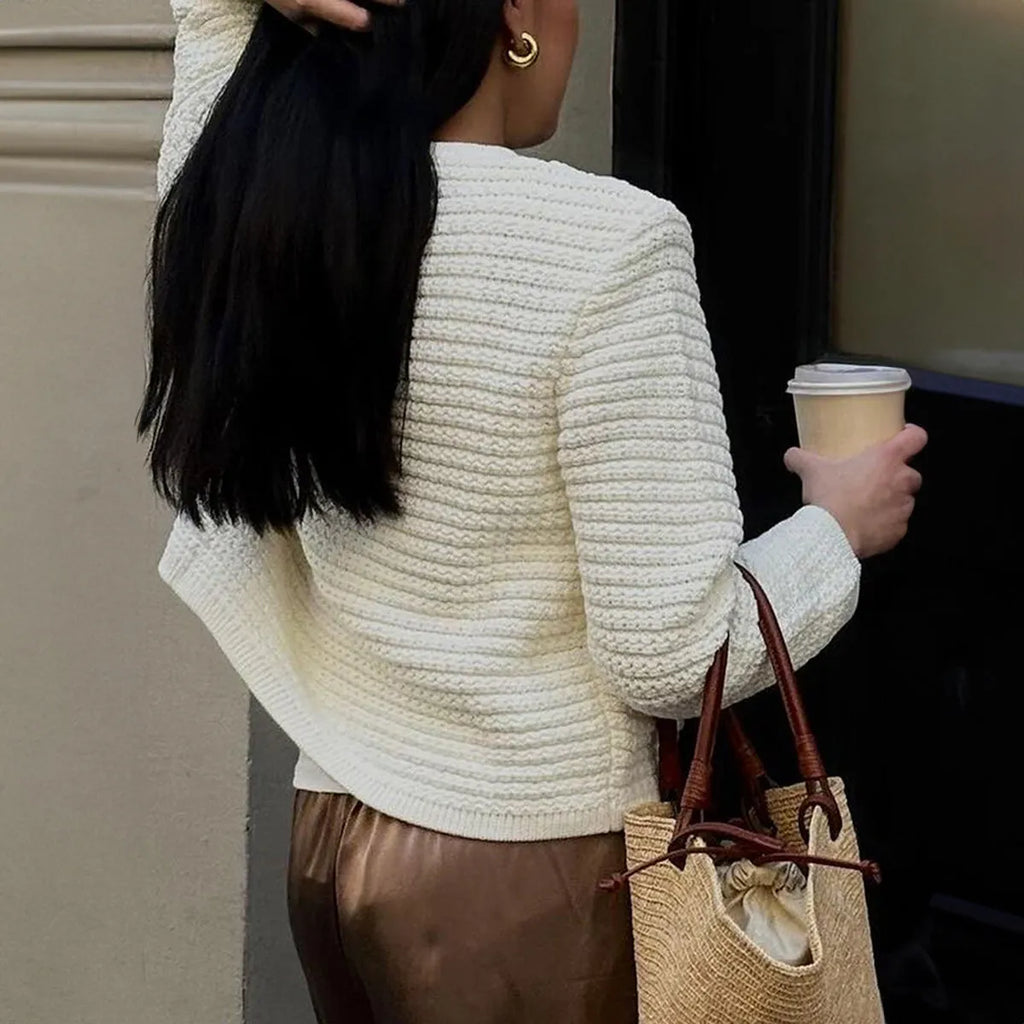 White women's long sleeve button shirt sweater made from polyester, front view