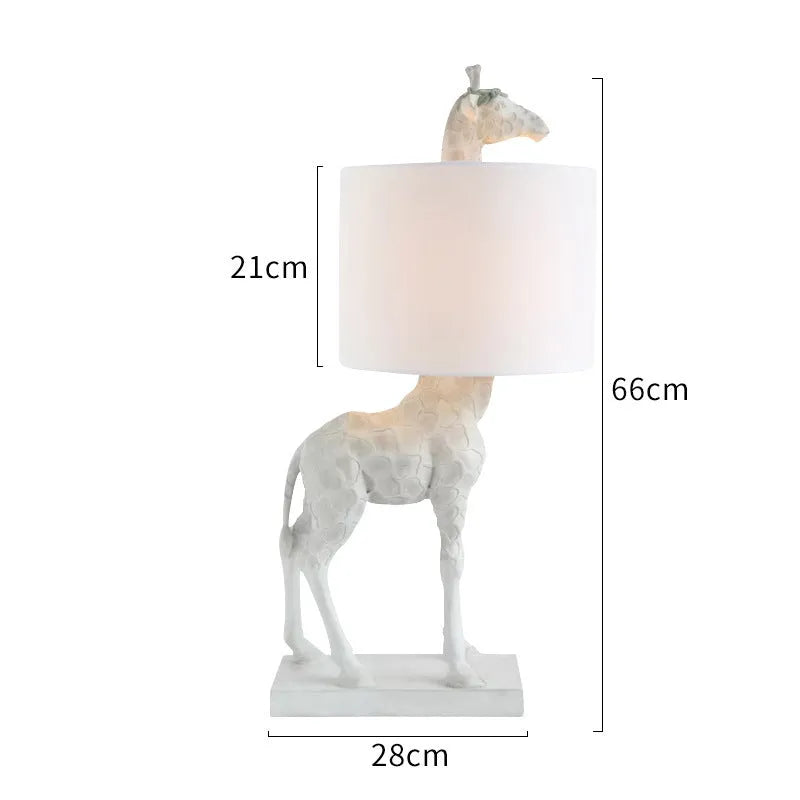 Giraffe table lamp with 66cm height in gold or white finish for bedside and desk lighting