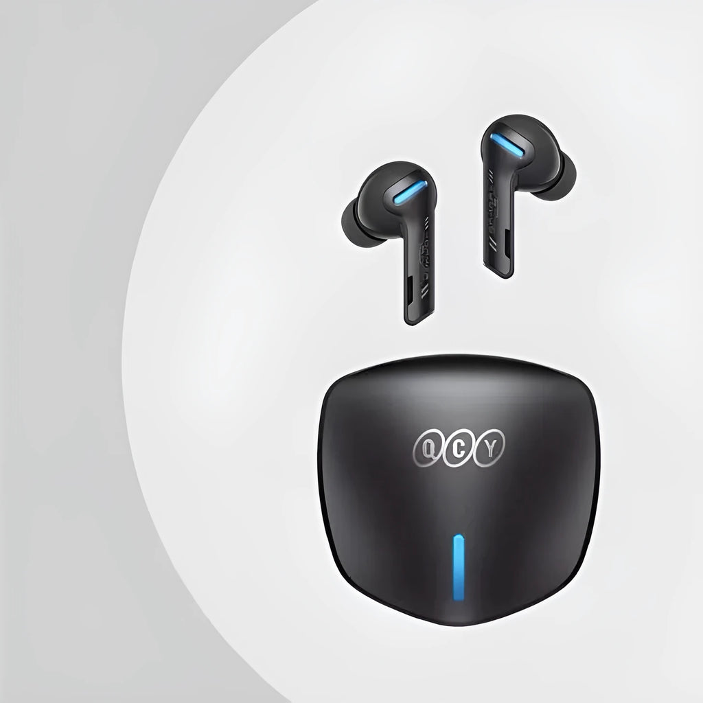 Grey QCY G1 wireless Bluetooth gaming headset with charging case and ear tips.