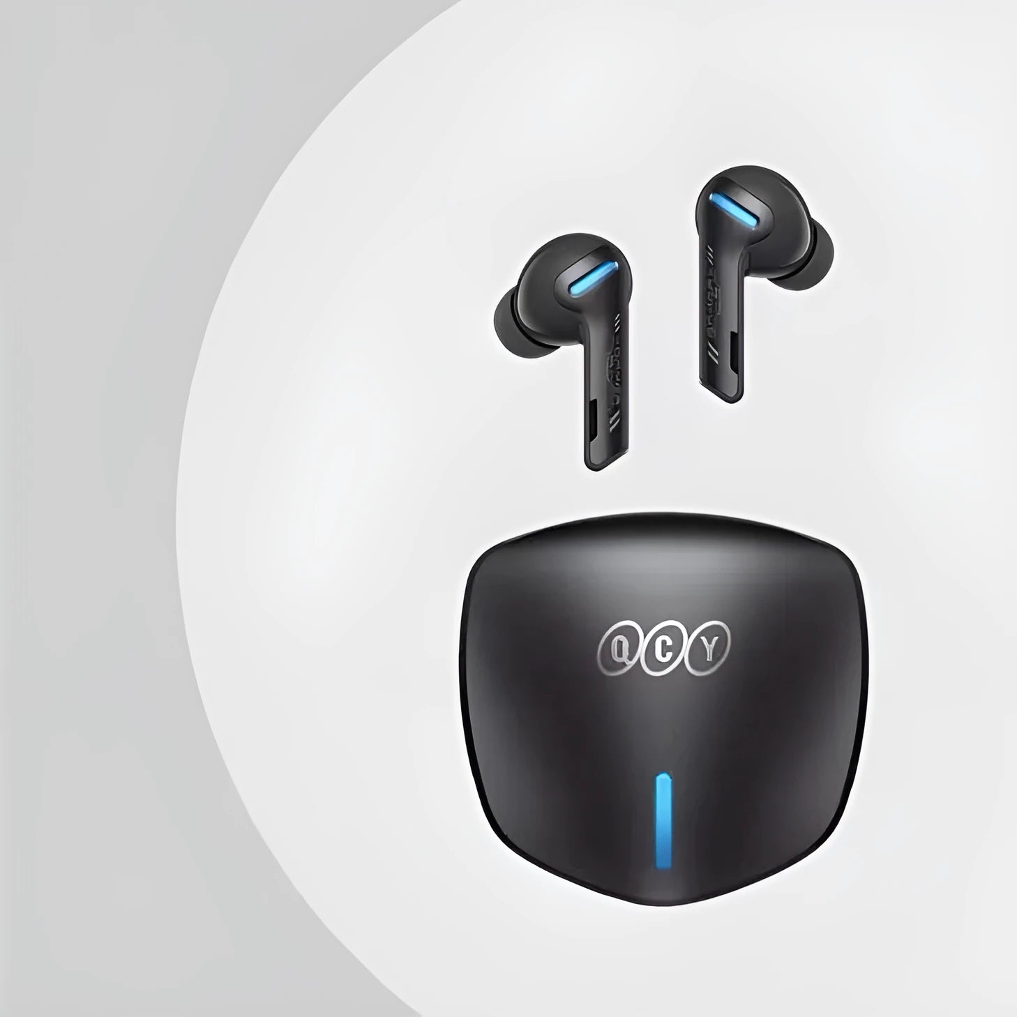 Grey QCY G1 wireless Bluetooth gaming headset with charging case and ear tips.